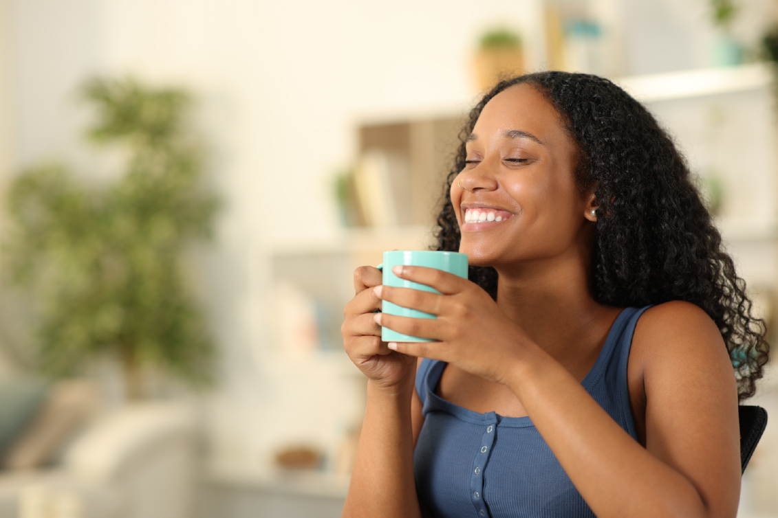 Girl enjoying a morning cup of coffee