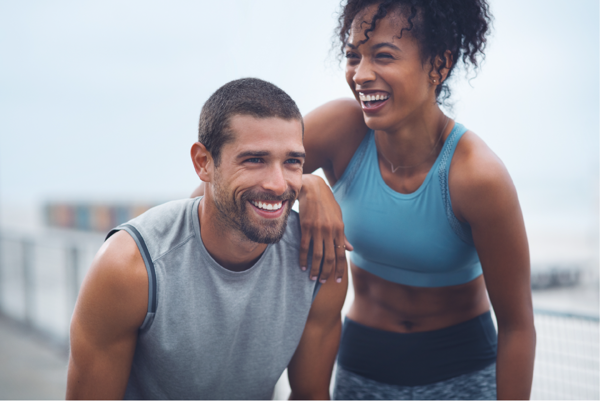 Man and women going for a run smiling